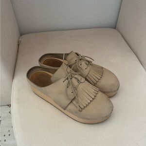 Used size 6 clogs discontinued Zoe clogs with fringe.

Light tan